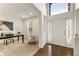 Bright, airy foyer with hardwood floors, a soaring two-story ceiling, and an adjacent living room at 5860 Fairway View Dr, Suwanee, GA 30024