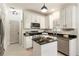 Well-lit kitchen featuring white cabinetry, granite countertops, and stainless steel appliances at 5860 Fairway View Dr, Suwanee, GA 30024
