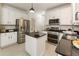 Modern kitchen with stainless steel appliances, granite countertops, and a center island at 5860 Fairway View Dr, Suwanee, GA 30024