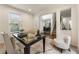 Bright living room showing hardwood floors, neutral decor, and an open view to the home's entry at 5860 Fairway View Dr, Suwanee, GA 30024