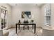 Light-filled living room featuring neutral tones, large windows, and ample natural light at 5860 Fairway View Dr, Suwanee, GA 30024