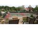 View of well-maintained tennis courts with a comfortable viewing deck, perfect for enjoying matches with friends and Gathering at 5860 Fairway View Dr, Suwanee, GA 30024