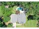 An aerial view of the sparkling pool with an umbrella and lounge chairs at 125 Foxridge Rd, Atlanta, GA 30327