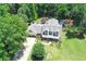 An aerial view of the landscaped front yard of the house and the front driveway at 125 Foxridge Rd, Atlanta, GA 30327