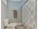 Clean bathroom features a patterned shower curtain, towel rack, and ceramic toilet at 125 Foxridge Rd, Atlanta, GA 30327