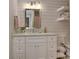 Charming bathroom showcasing a white vanity, shiplap walls, and a stylish mirror at 125 Foxridge Rd, Atlanta, GA 30327