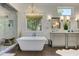 Luxurious bathroom with a freestanding tub, walk-in shower, and double vanity at 125 Foxridge Rd, Atlanta, GA 30327