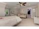 Cozy bedroom with comfortable beds, a window seat, and soft, neutral decor at 125 Foxridge Rd, Atlanta, GA 30327