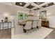 Well-lit dining room with coffered ceiling, large window and stylish furnishings at 125 Foxridge Rd, Atlanta, GA 30327