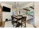 Dining area featuring a rustic table, pendant lights and a view to the kitchen at 125 Foxridge Rd, Atlanta, GA 30327