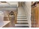 Inviting entryway featuring a staircase with wood railing and open access to the living area at 125 Foxridge Rd, Atlanta, GA 30327