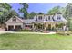 Beautiful two-story home boasting a cozy front porch and well-manicured front yard at 125 Foxridge Rd, Atlanta, GA 30327