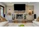 Stone fireplace with wood beam mantel and built-in cabinets in the living room at 125 Foxridge Rd, Atlanta, GA 30327