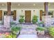 Charming front porch with stone pillars, wood accents, and a beautifully landscaped entrance at 125 Foxridge Rd, Atlanta, GA 30327