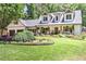 Charming two-story home with a manicured lawn and beautiful landscaping at 125 Foxridge Rd, Atlanta, GA 30327