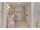 Bright hallway with gray walls, white trim, charming dresser, and a unique decorative mirror at 125 Foxridge Rd, Atlanta, GA 30327