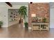 Inviting hallway features wood floors and exposed brick wall detail at 125 Foxridge Rd, Atlanta, GA 30327