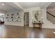 Hallway with wood-look floors and decorative shelves at 125 Foxridge Rd, Atlanta, GA 30327
