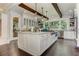 Gourmet kitchen featuring white cabinets, a central island, and stainless steel appliances at 125 Foxridge Rd, Atlanta, GA 30327