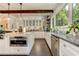 Bright kitchen with stainless steel appliances and a central island, open to the dining area at 125 Foxridge Rd, Atlanta, GA 30327