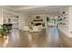 Bright, open-concept living room with a stone fireplace, hardwood floors, and ample natural light at 125 Foxridge Rd, Atlanta, GA 30327