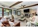 Open concept living room with fireplace and doors to outside at 125 Foxridge Rd, Atlanta, GA 30327