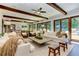 Spacious living room with beamed ceilings, hardwood floors and access to outside at 125 Foxridge Rd, Atlanta, GA 30327