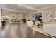Spacious living room showcasing hardwood floors, elegant seating, and a view into the dining area at 125 Foxridge Rd, Atlanta, GA 30327