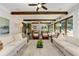 Spacious living room with beamed ceilings, hardwood floors and access to outside at 125 Foxridge Rd, Atlanta, GA 30327