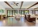 Spacious living room with wood floors, ceiling beams, and doors leading to the outside at 125 Foxridge Rd, Atlanta, GA 30327