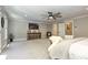 Spacious main bedroom with large TV, seating area, and plush carpeting at 125 Foxridge Rd, Atlanta, GA 30327