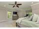 Spacious main bedroom with a large window view, ceiling fan and dresser at 125 Foxridge Rd, Atlanta, GA 30327