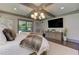 Relaxing bedroom features neutral colors, wooden floors and recessed lighting at 125 Foxridge Rd, Atlanta, GA 30327