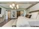 Cozy bedroom with wood flooring, large windows, and stylish chandelier at 125 Foxridge Rd, Atlanta, GA 30327