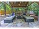 Inviting covered seating area with comfortable couches, a coffee table, and a ceiling fan at 125 Foxridge Rd, Atlanta, GA 30327