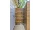 Invigorating outdoor shower with natural wood enclosure providing privacy, perfect for rinsing off after a swim at 125 Foxridge Rd, Atlanta, GA 30327