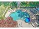 The beautiful pool area with an outdoor kitchen and fireplace in the backyard at 125 Foxridge Rd, Atlanta, GA 30327