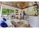 Modern outdoor kitchen featuring stainless steel appliances, ample counter space, and cozy seating area at 125 Foxridge Rd, Atlanta, GA 30327