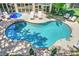 Sparkling kidney-shaped pool with lounge chairs, patio, and shade; an outdoor oasis for relaxation and enjoyment at 125 Foxridge Rd, Atlanta, GA 30327