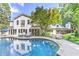 Inviting backyard pool with lounge chairs and a spacious patio area, perfect for outdoor relaxation and entertaining at 125 Foxridge Rd, Atlanta, GA 30327