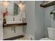 Stylish powder room features shiplap accent wall and modern floating sink at 125 Foxridge Rd, Atlanta, GA 30327