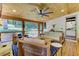 Cozy sun room with natural light, wood ceiling, and screened windows at 125 Foxridge Rd, Atlanta, GA 30327