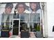 Storefront with mural art and hanging business hours sign at 172 Haynes Sw St # 107, Atlanta, GA 30313