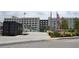 Open plaza with shipping containers, public art sculpture, and a view of surrounding buildings at 172 Haynes Sw St # 107, Atlanta, GA 30313