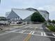 Mercedes Benz Stadium area featuring modern architecture, lush trees and nearby street parking at 172 Haynes Sw St # 107, Atlanta, GA 30313
