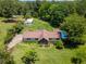 Aerial view of a property featuring a pool, garage, and mature landscaping at 3769 Bay Creek Church Rd, Loganville, GA 30052