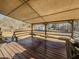 Back porch with a wood deck and ceiling, overlooking the backyard at 3769 Bay Creek Church Rd, Loganville, GA 30052