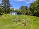 Large backyard with a garden and tool shed at 3769 Bay Creek Church Rd, Loganville, GA 30052