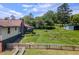 Sprawling backyard with a pool, deck, lush lawn, and a shed at 3769 Bay Creek Church Rd, Loganville, GA 30052
