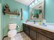 Well-lit bathroom with elegant tile flooring, vanity, and framed mirror at 3769 Bay Creek Church Rd, Loganville, GA 30052